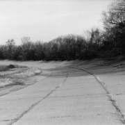 black and white image of the north east curve of the test track taken in 1998 at the Packard Proving Grounds Historic Site