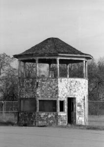 black and white image of the original timing stand in disrepair at the Packard Proving Grounds Historic Site