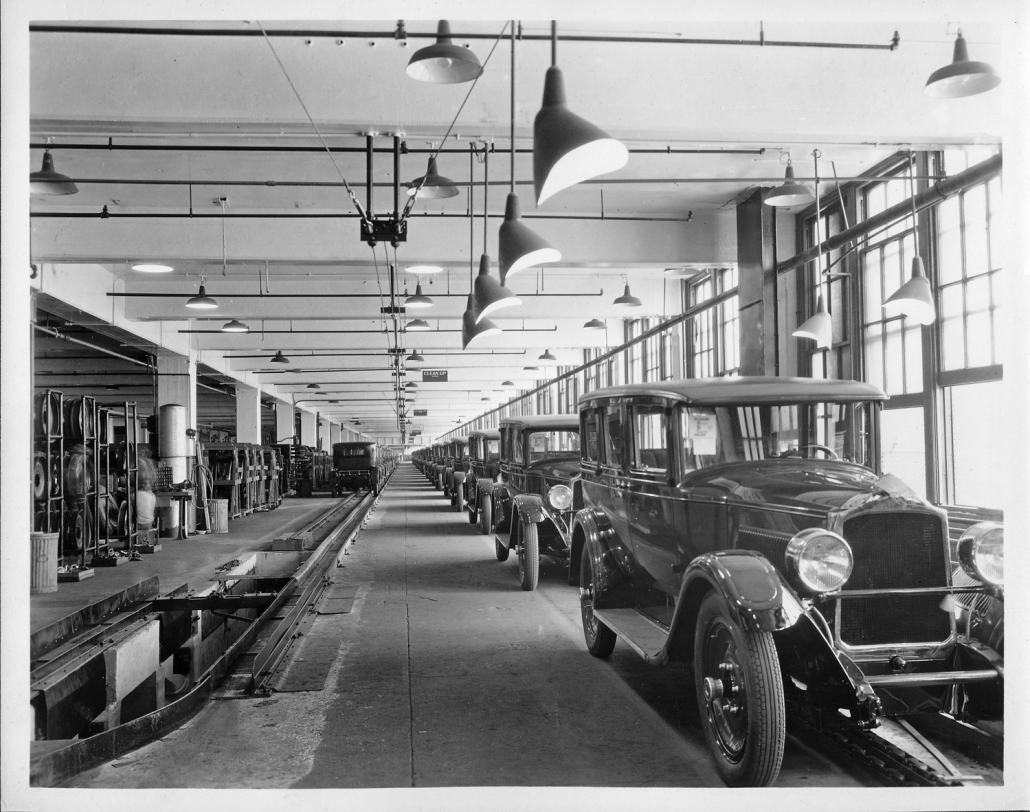 Packard Co. file photograph of the 1927 Packard assembly line, finished bodies of the Packard Six coming down final inspection line