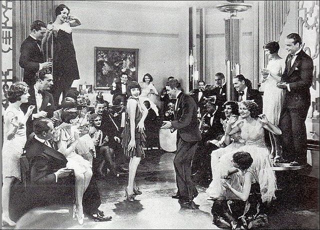 Roaring Twenties party guests dancing in evening attire